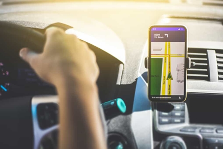 Rideshare driver uses the app to navigate while driving