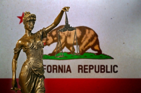 lady justice in front of the california flag