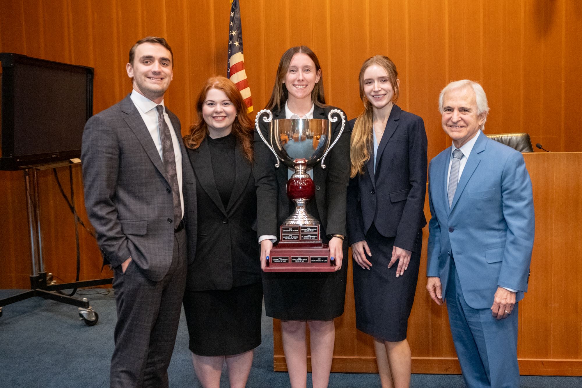 Image of Team With Bruce and a trophy