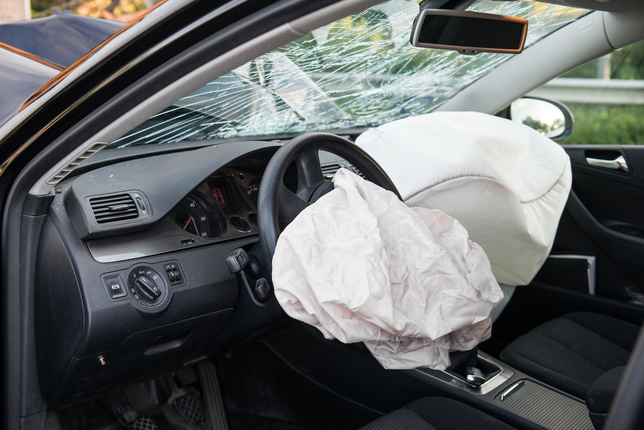 Cracked windshield and deployed airbag